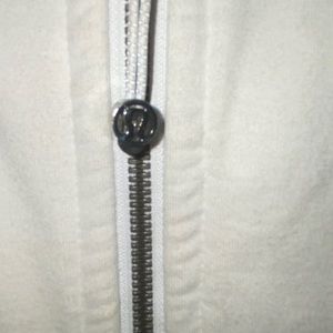 White, light lululemon sweatshirt.